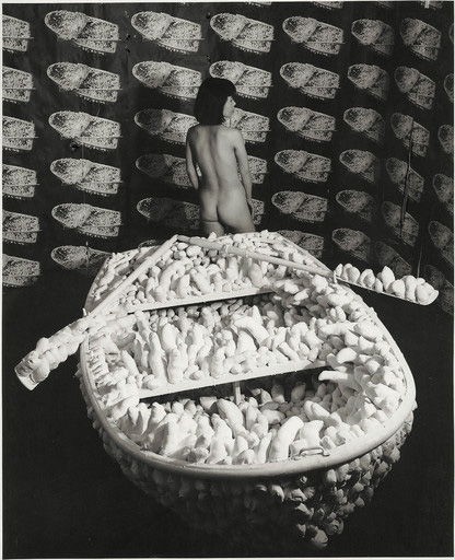 Yayoi Kusama Kusama posing in Aggregation: One Thousand Boats Show 1963 installation view, Gertrude Stein Gallery, New York 1963 © Yayoi Kusama and © Yayoi Kusama Studios Inc.