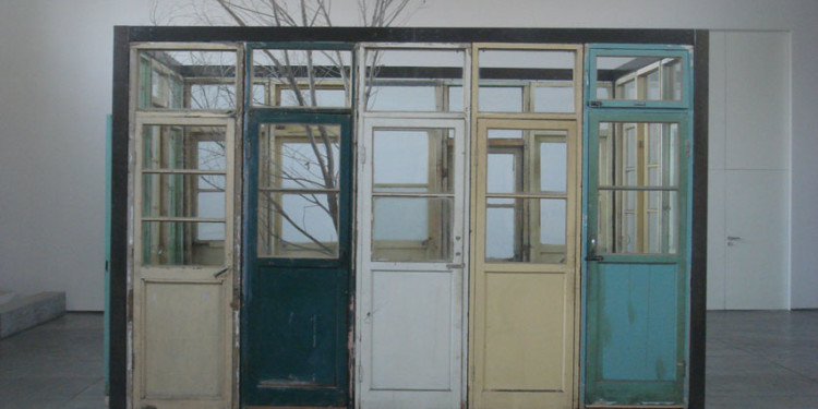 Song Dong Intelligence of the Poor: Living with the Tree穷人的智慧：与树共生, 2005 Installation Steel pipe, wooden door, wooden bed, withered tree, bed sheets 392 x 245 x 265 cm Courtesy Pace Beijing