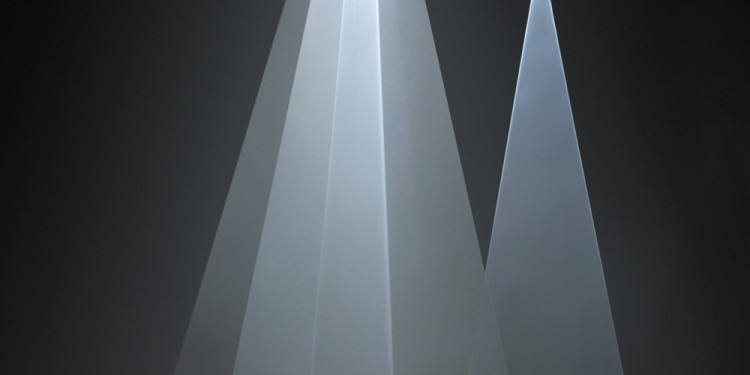 Anthony McCall. "Between You and I" (2006). Installation view at Peer/The Round Chapel, London, 2006. Vertical solid light installation. 30-minute cycle in two parts. Computer, QuickTime movie file, two video projectors, two haze machines. Dimensions variable. Photograph by Hugo Glendinning. Courtesy Sean Kelly Gallery, New York.