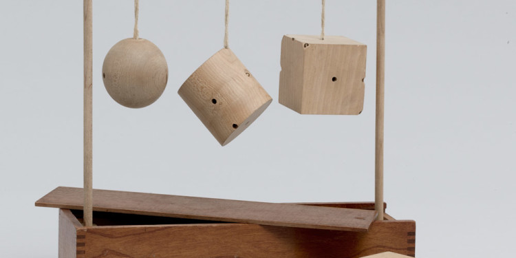 Froebel Gift No. 2: Sphere, Cylinder, and Cube. c. 1890. Wood and string, 11 1/4 x 10 1/4 x 3″ (28.6 x 26 x 7.6 cm). Manufactured by J. L. Hammett Co., Braintree, Massachusetts (est. 1863). The Museum of Modern Art, New York. Gift of Lawrence Benenson, 2011